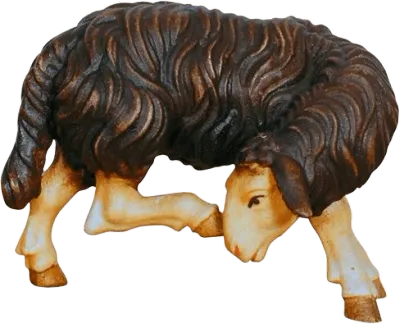 Hand-carved wooden dark brown sheep scratching with detailed wool texture