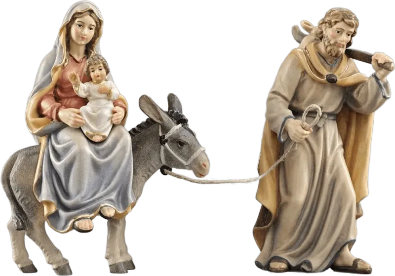 Hand-carved wooden Flight Into Egypt nativity scene with Mary holding baby Jesus on donkey led by Joseph