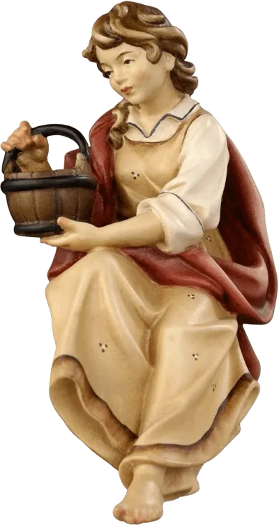Hand-carved wooden shepherdess seated holding a bucket, hand-painted with cream and red clothing
