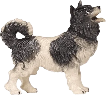 Hand-carved and hand-painted wooden dog figure in black and white from Pema Rainell collection