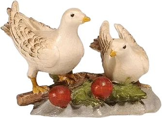 Pair of hand-carved and hand-painted wooden doves on a branch with berries