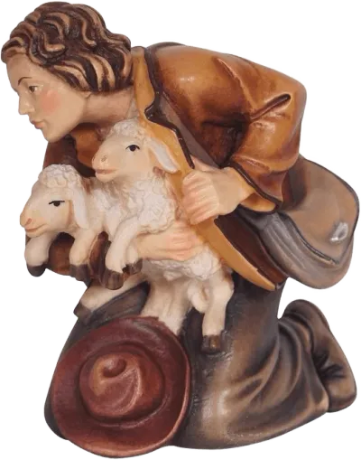 Hand-carved wooden shepherd kneeling holding two lambs, painted in warm browns and creams